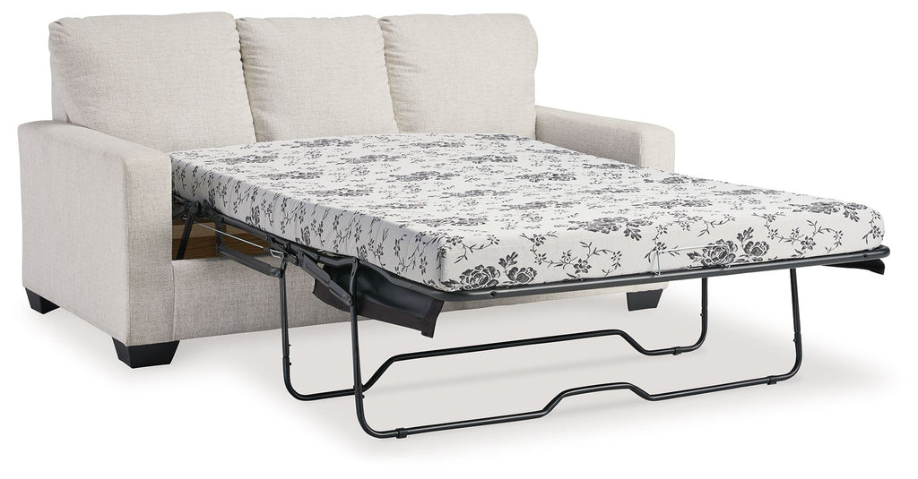 Light beige sofa bed with pulled-out mattress and floral patterned cover