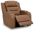 Power recliner with caramel-toned padded seat and separate pull-out footrest