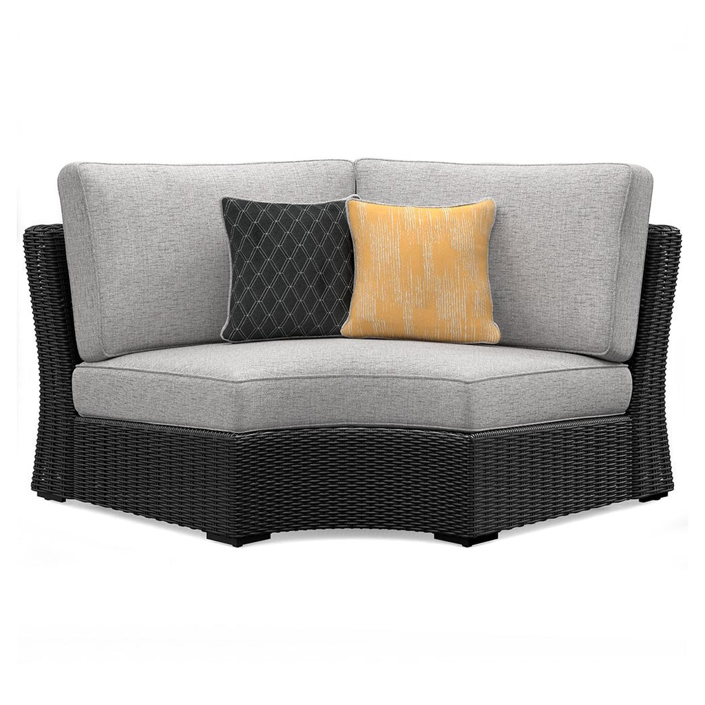Black curved corner chair with light gray seat and back cushion, plus two throw pillows