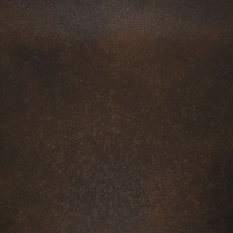 Distressed brown metal lamp surface with textured finish