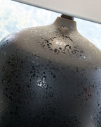 Black speckled ceramic lamp neck and base with white drum shade top edge