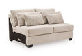Mandi Point armless loveseat, light beige with four throw pillows