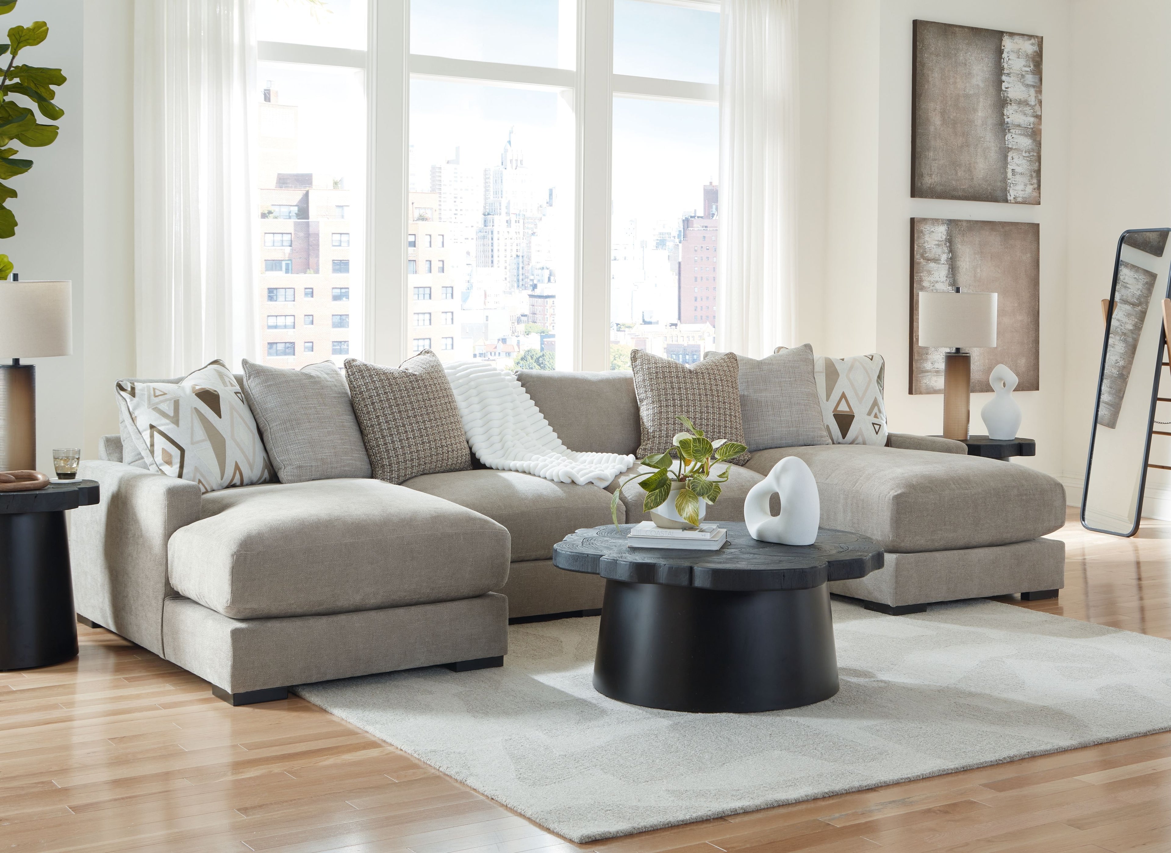 Pebble gray sectional sofa with chaise seats and geometric accent throw pillows