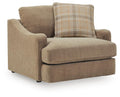 Chair and a half upholstered chair in tan fabric with plaid accent pillow and wide arms