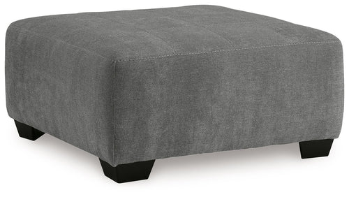 Gray oversized accent ottoman with rounded top and black legs