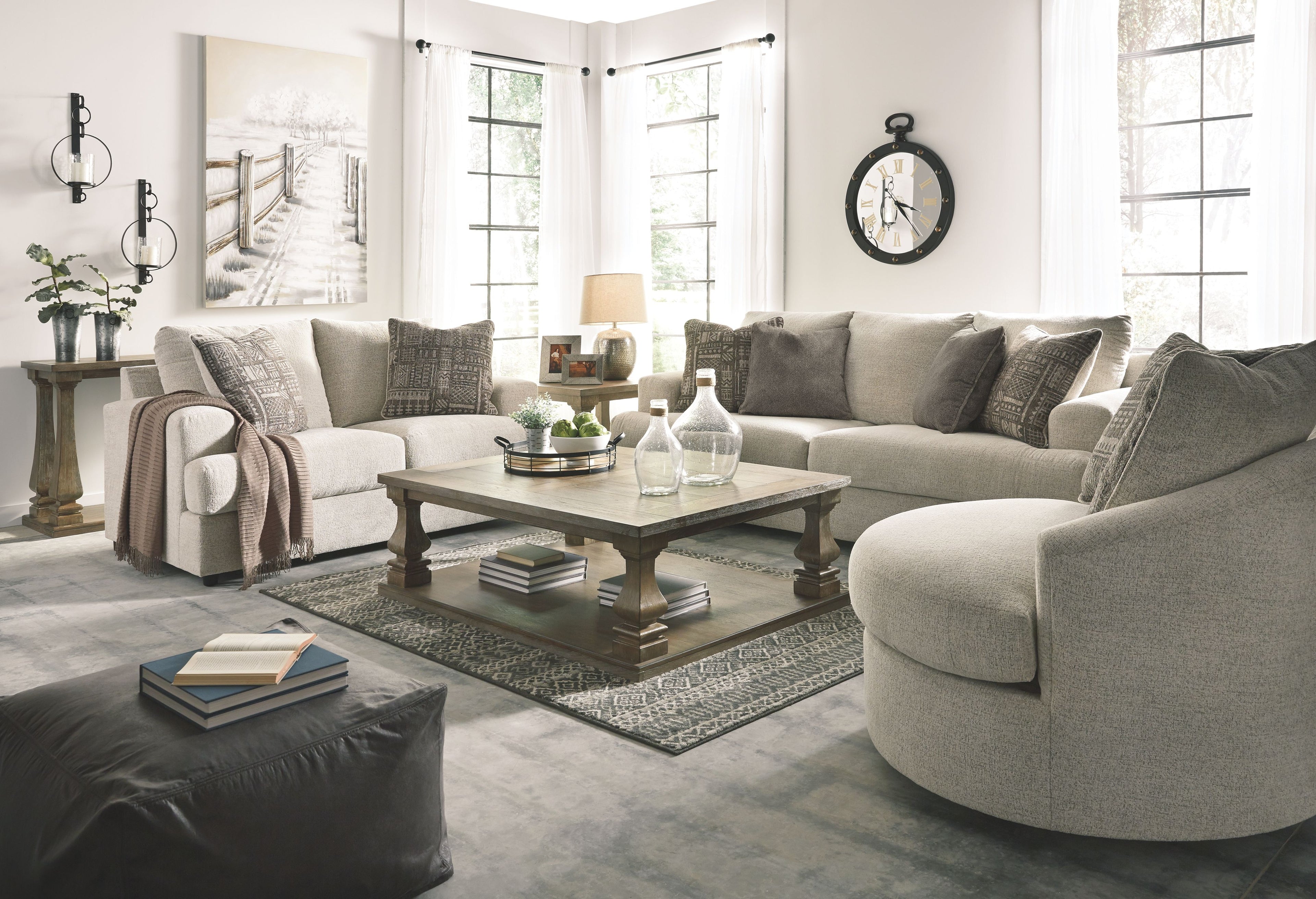 Beige fabric living room sofa set with ottoman and decorative throw pillows