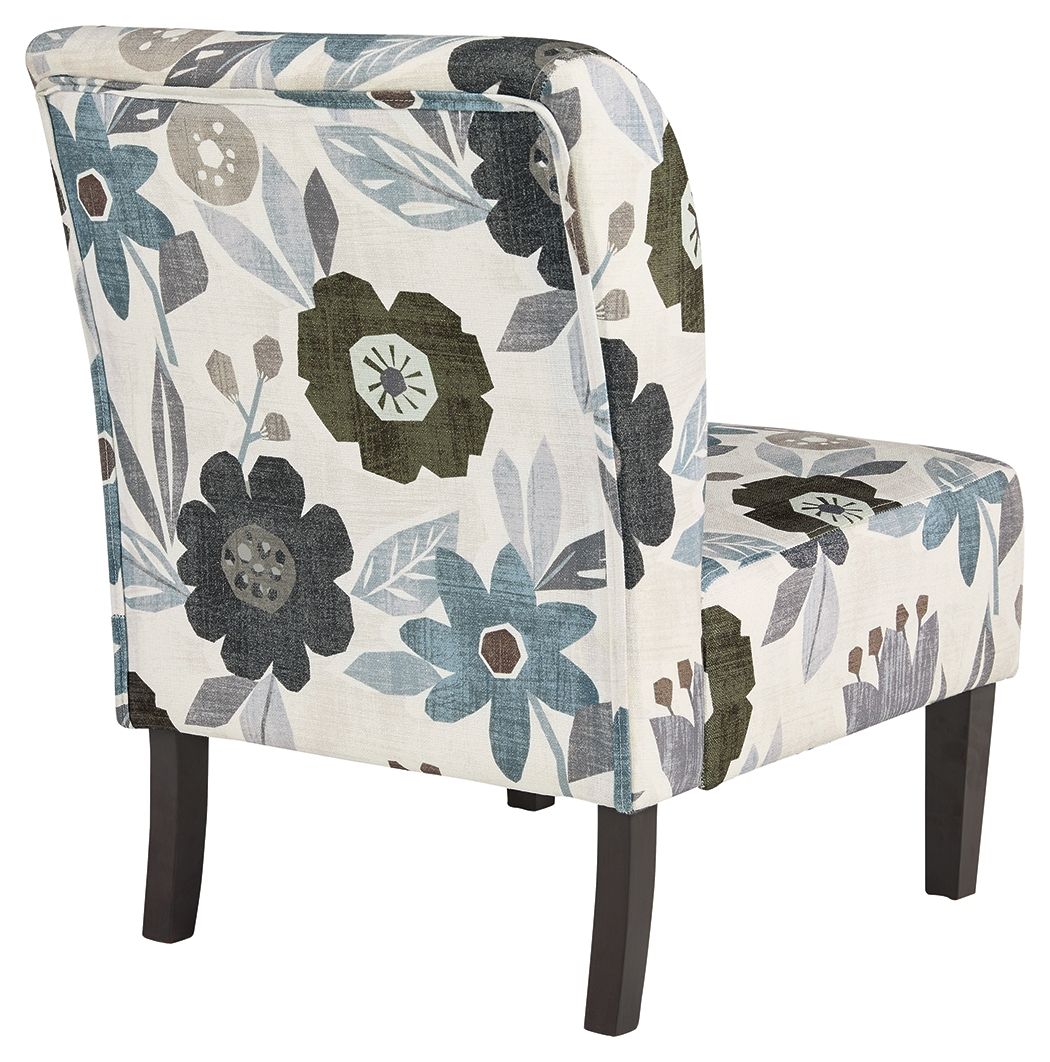 Accent chair with blue-gray floral upholstery and dark wood legs, side view.