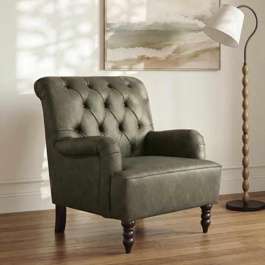 Green upholstered accent chair with tufted back, padded arms, and dark wooden legs
