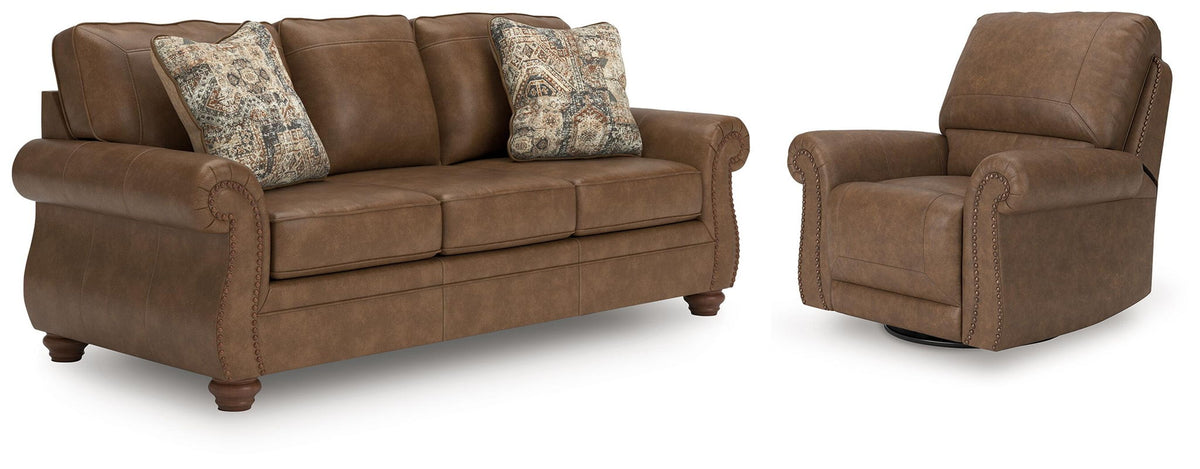 Dark brown sofa with two patterned accent pillows and matching recliner chair