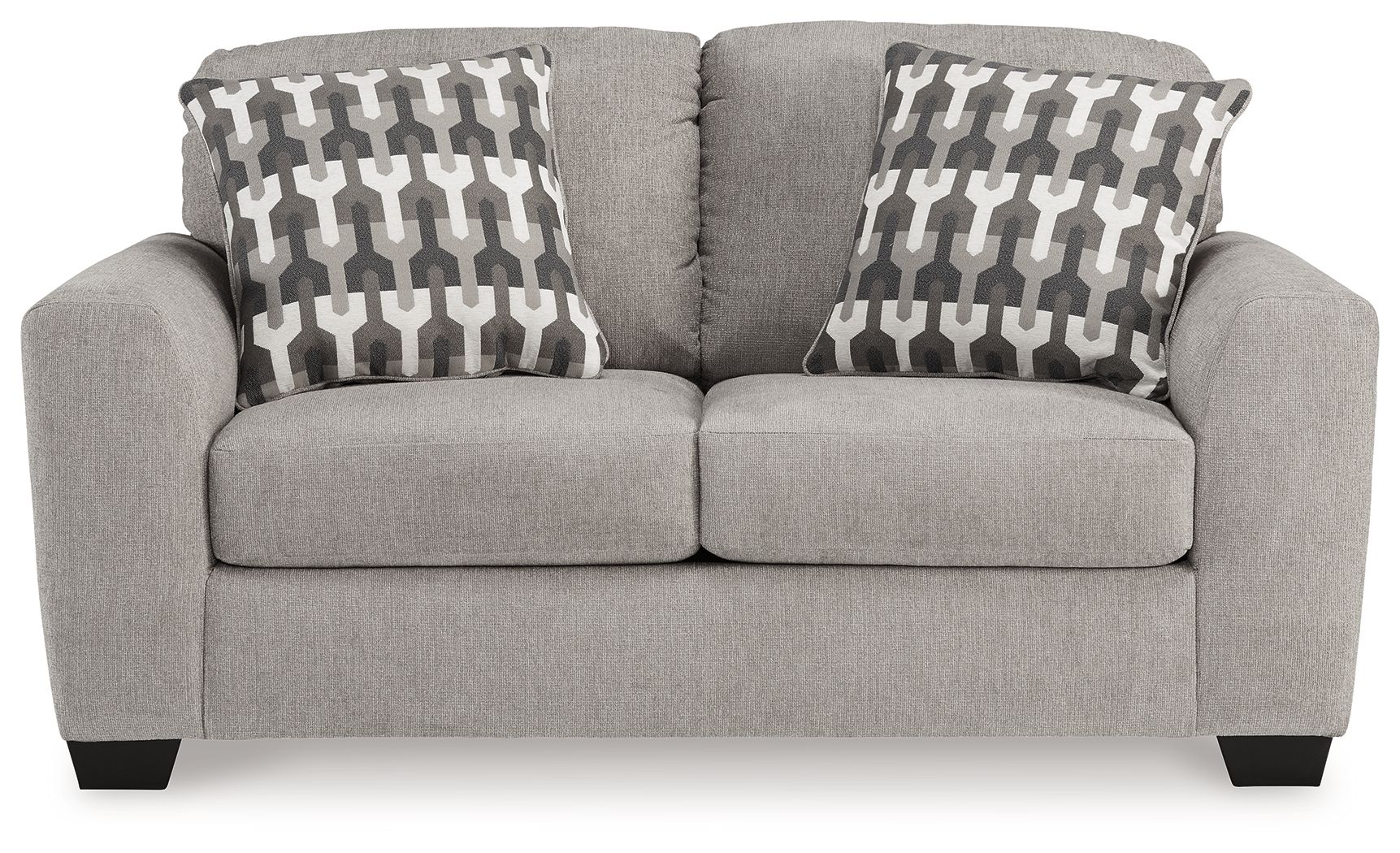 Gray flannel loveseat with two patterned pillows and cushioned arms