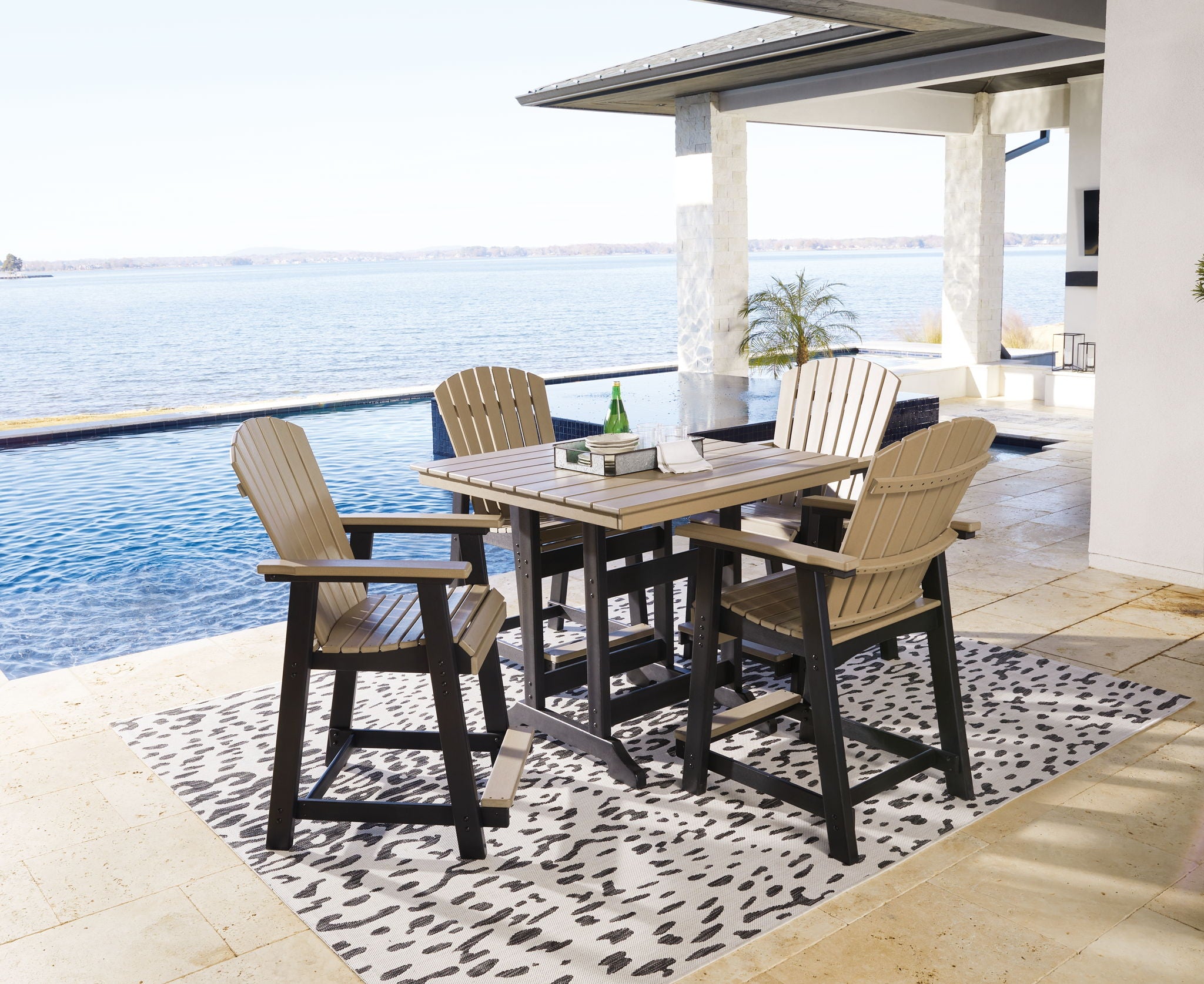 Outdoor counter dining set with four driftwood slat chairs and dark square table