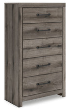 Five-drawer chest in gray wood with metal bar pulls, front view.