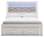 White bookcase bed with tufted gray headboard, blue-lit shelves, and two storage drawers