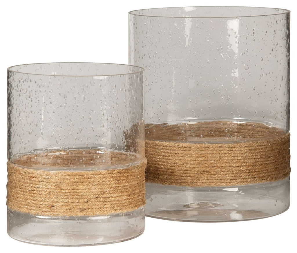Pair of clear cylindrical glass candle holders with speckled texture and jute band