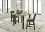Counter-height dining table with dark brown upholstered stools and marble-look top