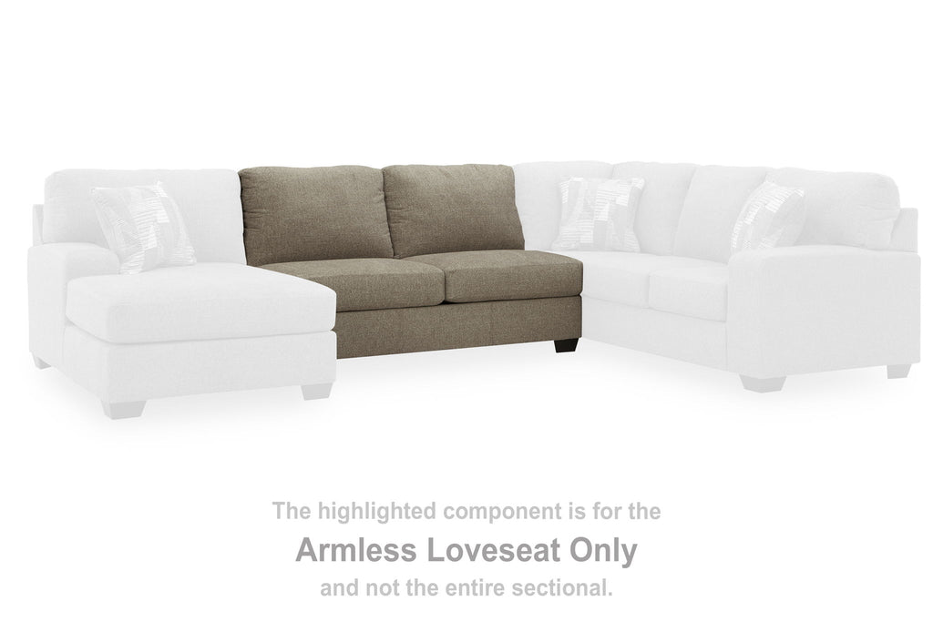Beige armless loveseat component with two seat cushions and two back pillows