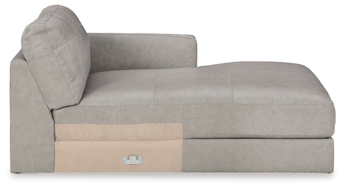 Light gray corner chaise with tufted back and beige front access panel