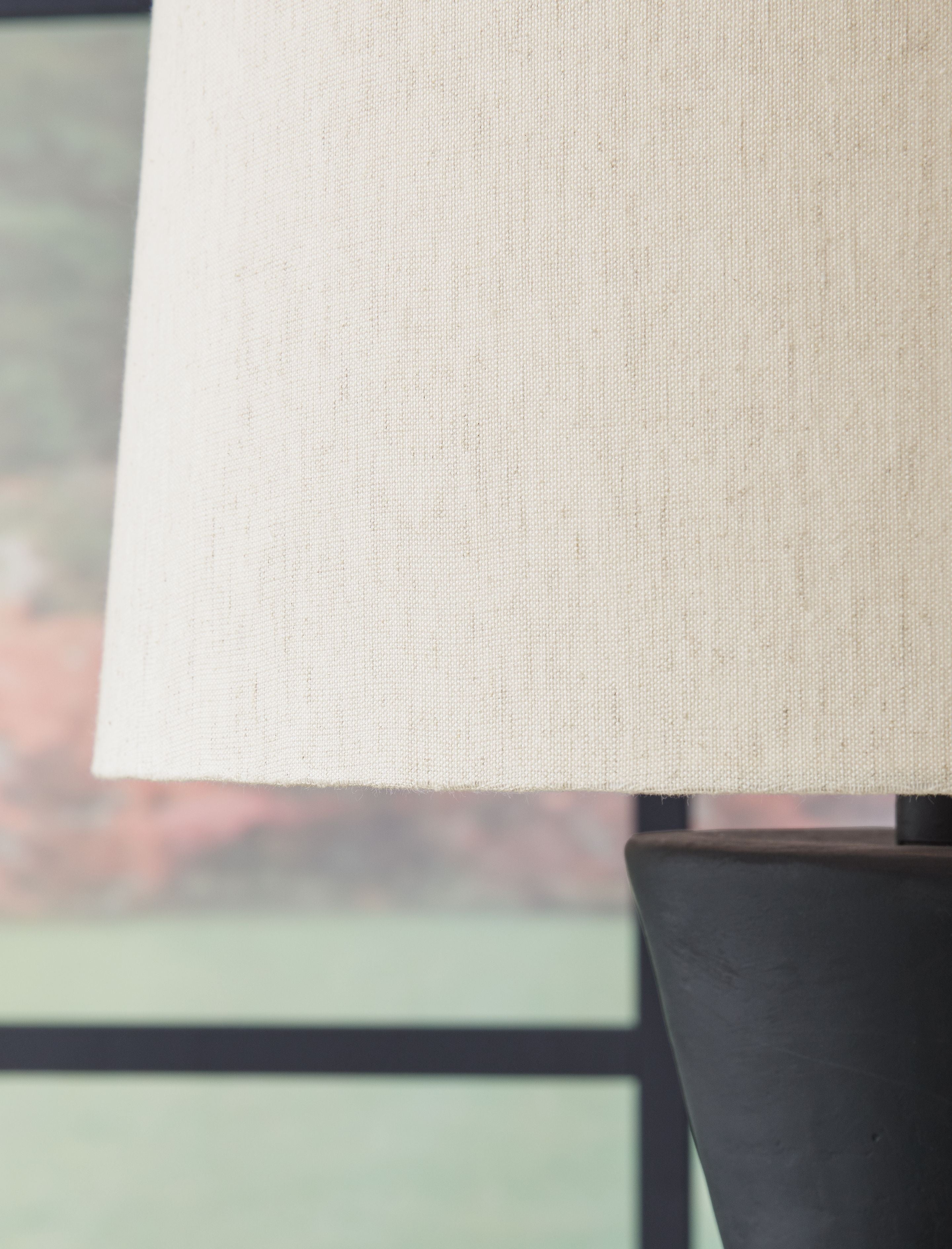 Paper lamp shade with distressed black base, view from the top