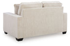 Light beige upholstered loveseat with two back cushions and thick armrests
