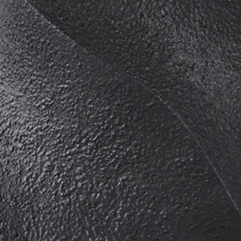 Textured black poly lamp base detail with sculpted surface