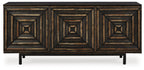 Distressed black accent cabinet with three geometric door fronts and four legs.