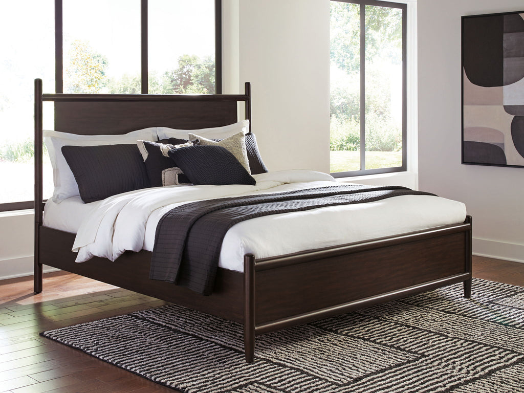 Dantenton panel bed in dark brown with pillows and white bedding