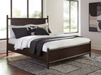 Dantenton panel bed in dark brown with pillows and white bedding