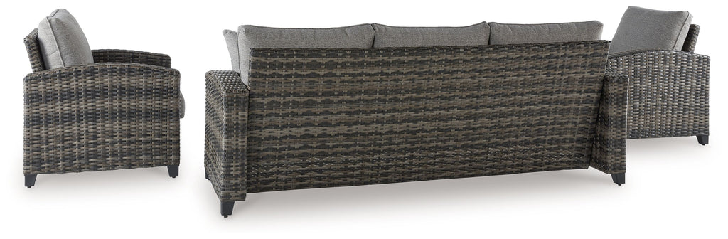 Gray wicker outdoor sofa and two armchairs with coffee table