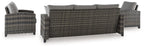 Gray wicker outdoor sofa and two armchairs with coffee table