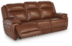 Dark brown leather power reclining sofa with padded headrests and side control panel