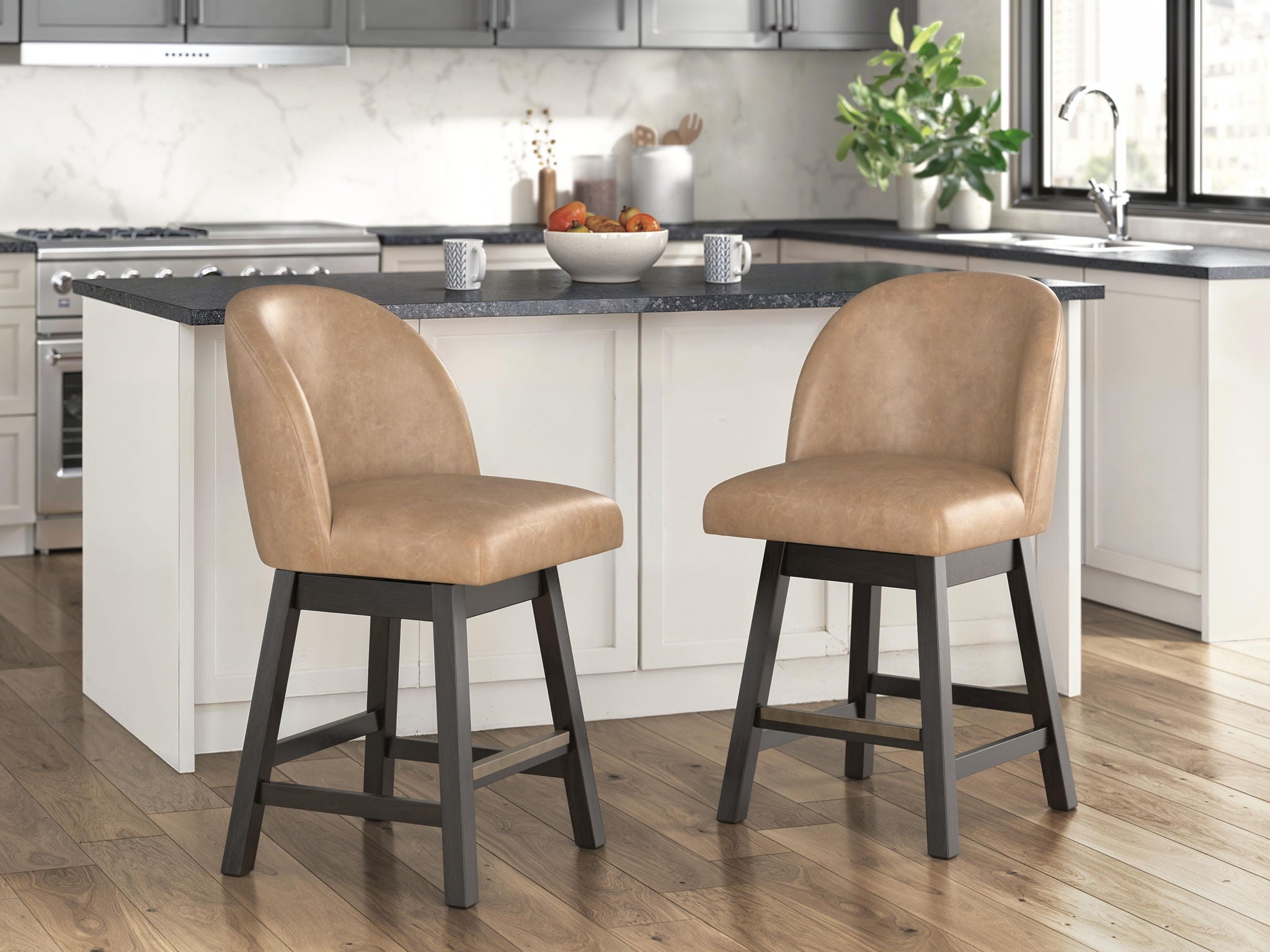 Pair of medium brown faux leather barstools with dark angled legs and rounded cushioned backs