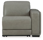 Gray power recliner chair with padded back, rounded armrest, and contrast stitching