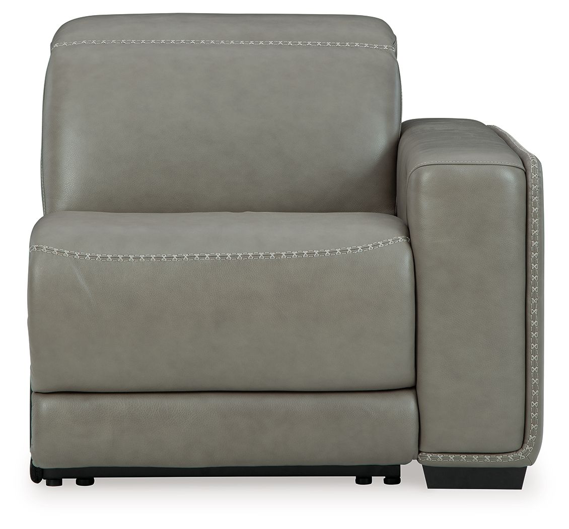 Gray power recliner chair with padded back, rounded armrest, and contrast stitching