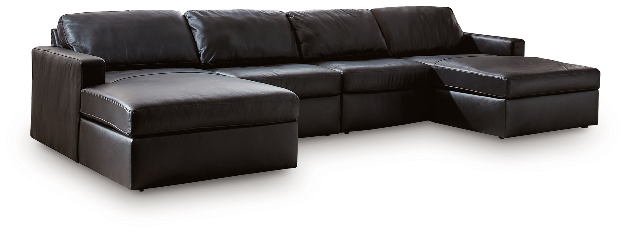 Black sectional sofa with chaise and cushioned armrests