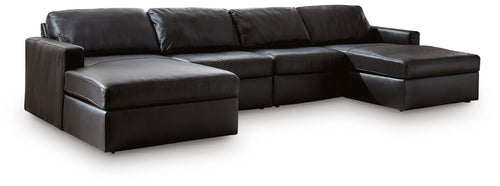 Black sectional sofa with chaise and cushioned armrests