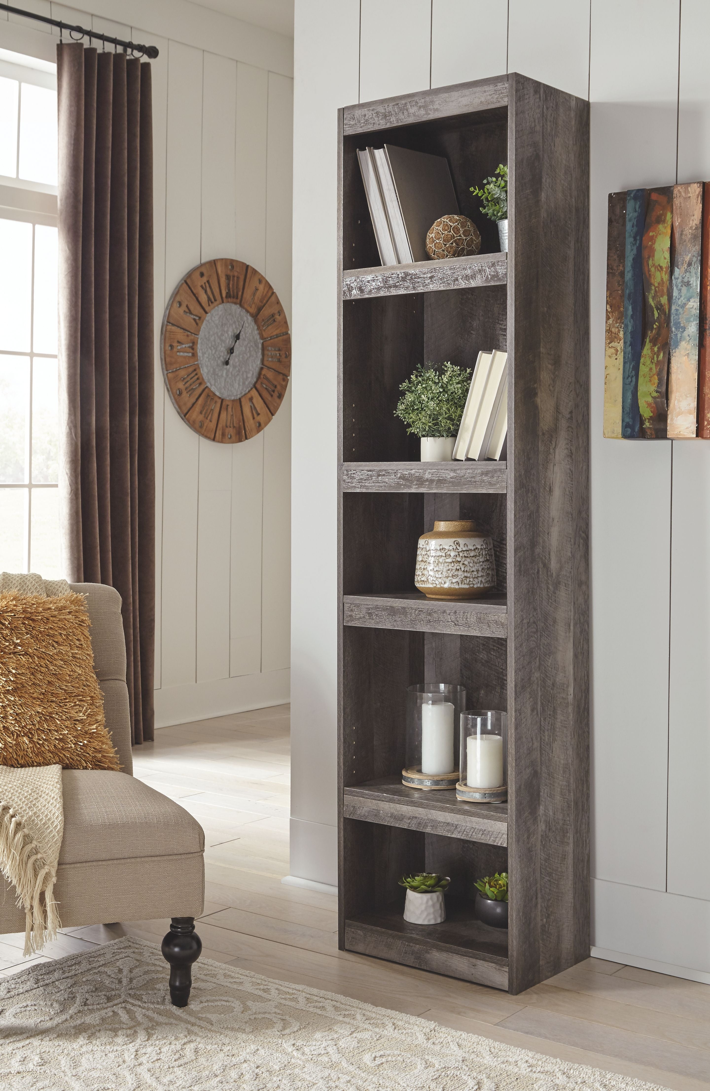 Gray open shelving cabinet with multiple shelves and decor items on shelves