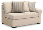 Left-facing loveseat chair with light beige upholstery, side armrest, and three throw pillows