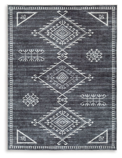 Black rug with cream and gray geometric medallion pattern, flatwoven design