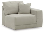 Gray upholstered corner chair with rounded arms and cushioned seat