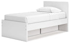 White panel platform bed with headboard and low-profile side storage drawers.