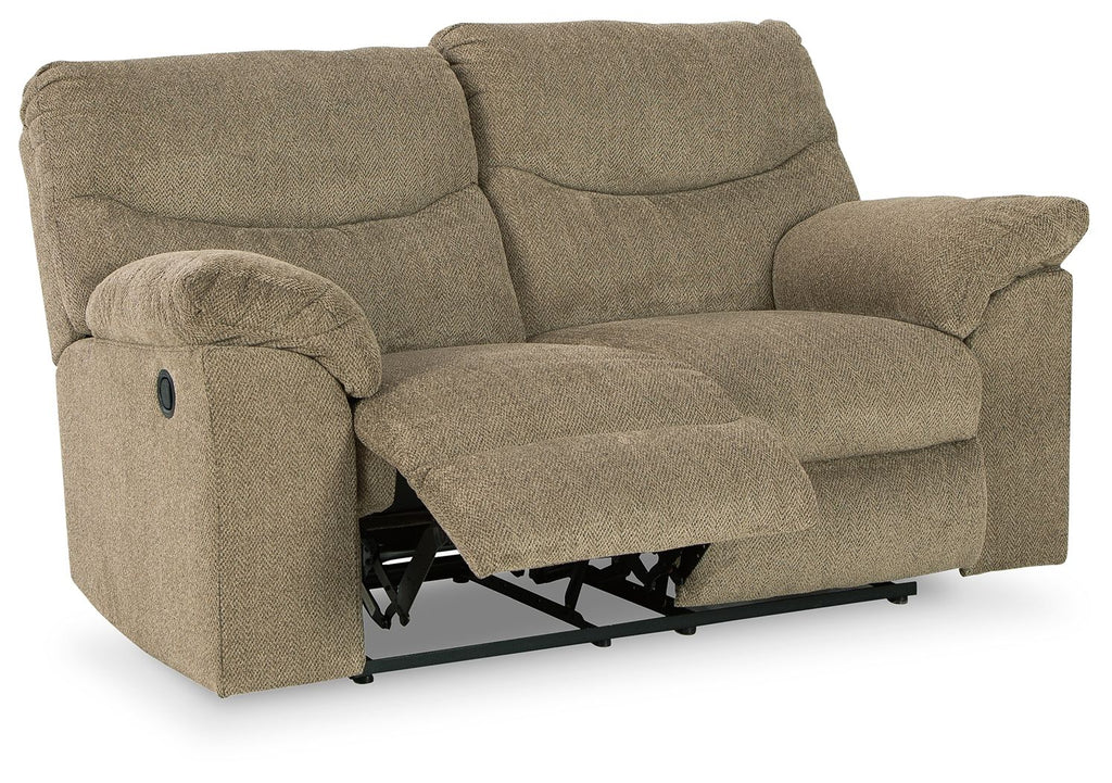 Reclining loveseat in beige fabric with extended footrest and visible mechanism