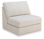 Light beige upholstered armless chair with square back and cushioned seat