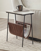 Accent table with white top, black frame, brown leather magazine holder and mug