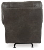 Upholstered rocker recliner chair in pewter gray, squared back and padded arms.