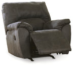 Upholstered rocker recliner chair in pewter gray, side view with recline footrest.