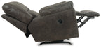 Pewter rocker recliner chair from side with exposed rocker base and lever.