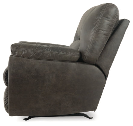 Pewter rocker recliner chair with padded armrests and wide back cushion.