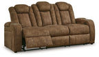 Brindle brown power reclining sofa with padded armrests and extended footrests