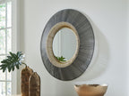 Round accent mirror with black textured outer ring and gold-toned inner bezel