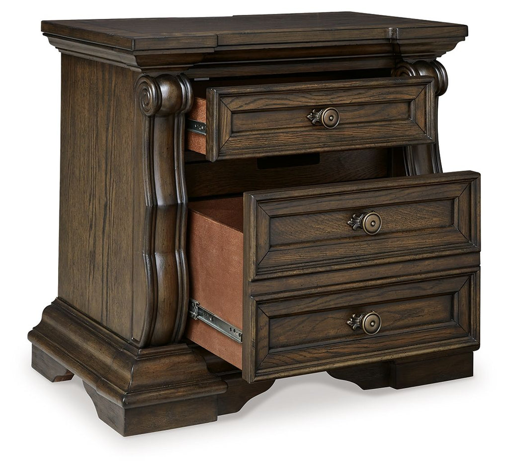 Dark brown three-drawer night stand with carved legs and metal drawer pulls